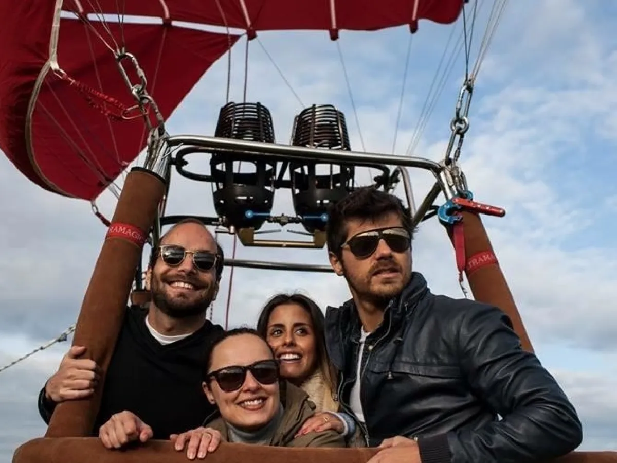 a person standing next to a body of water